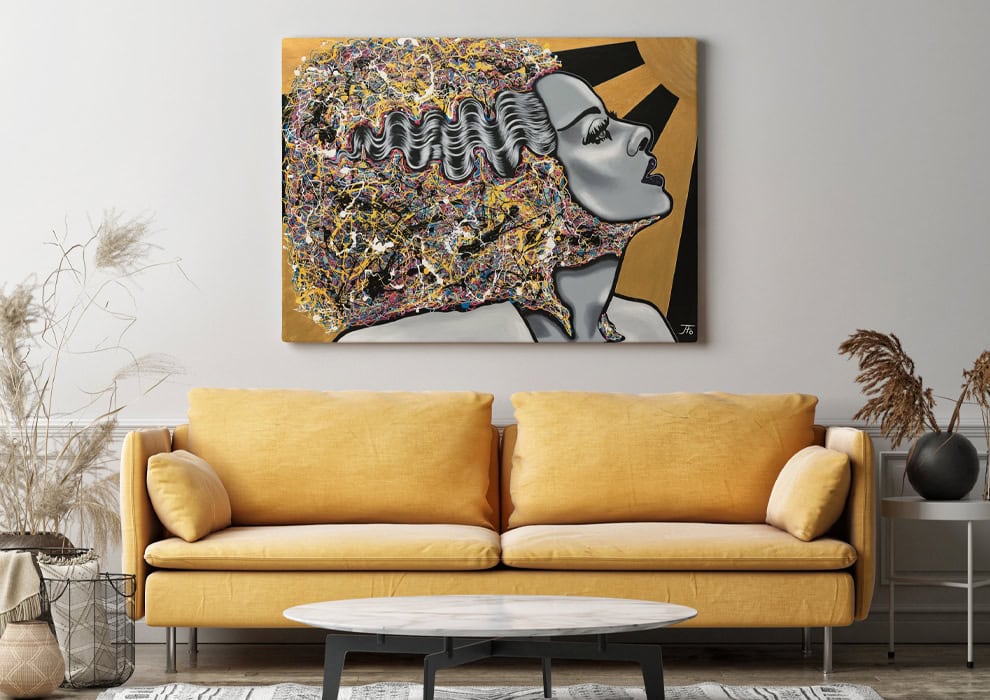 Original Bride I painting hanging above yellow couch.