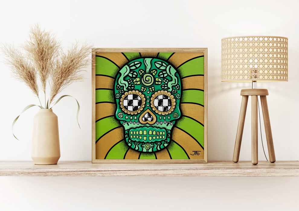 Original Green Sugar Skull painting resting on shelf.