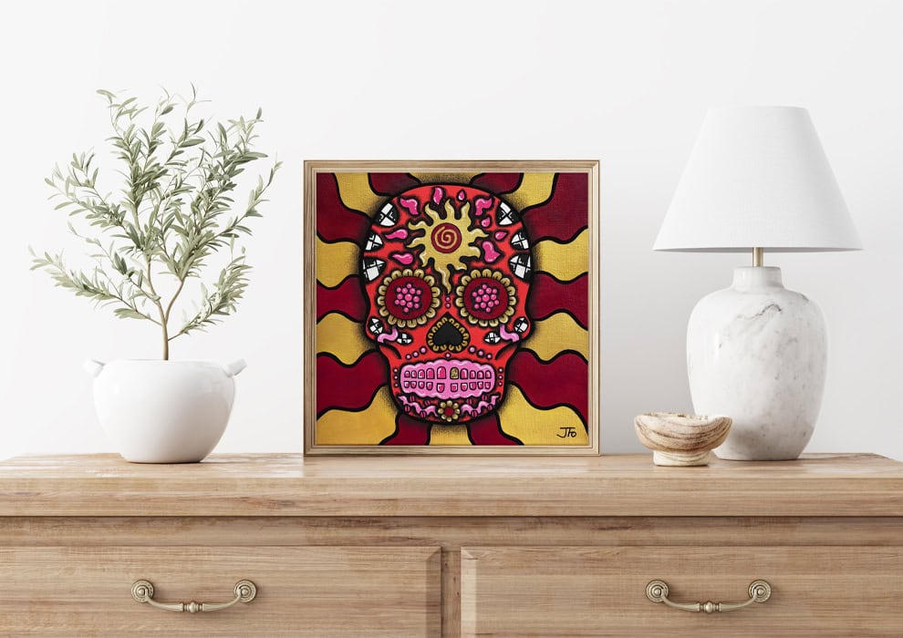 Original Red Sugar Skull resting on dresser.