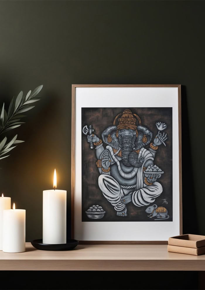 Ganesha print framed and sitting on shelf.