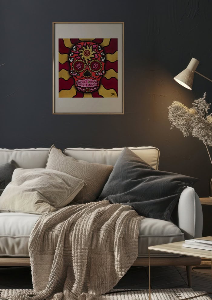 Red Sugar Skull print framed and hung above couch.